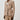 Person wearing a beige suit with a white background