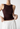 Open-back brown knit top, women's sleeveless summer top, casual open-back tank top for women, women's trendy summer sleeveless blouse, stylish open-back knit tank, women's open-back fashion top, brown sleeveless knit sweater, women's summer layering top, casual chic sleeveless top, women's vintage-inspired knit tank, summer fashion top for women, women's fall and summer knit top, trendy open-back sleeveless blouse.

Regenerate
Copy
Good response
Bad response

